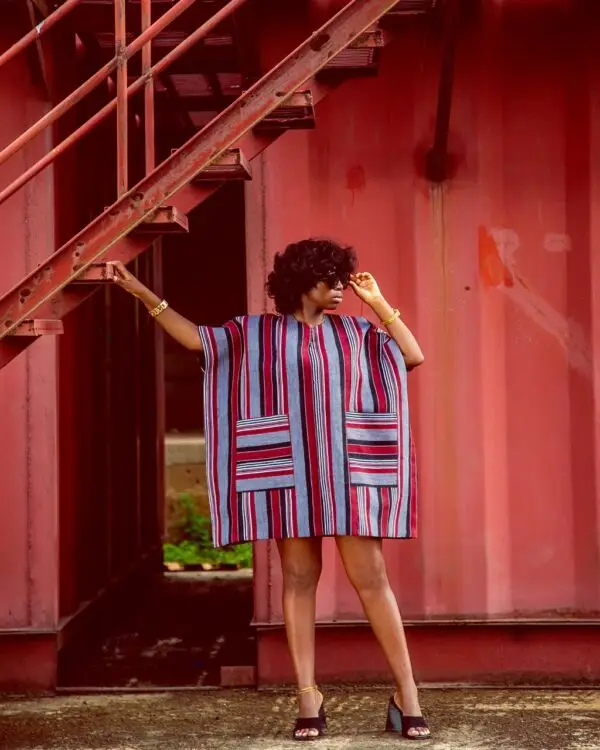 lady wearing a dress made from Aso oke