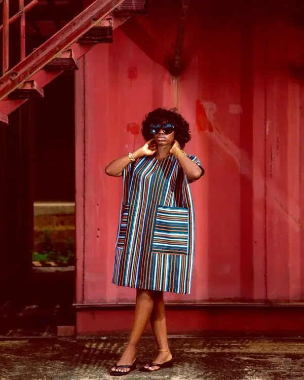 lady wearing a dress made from Aso oke